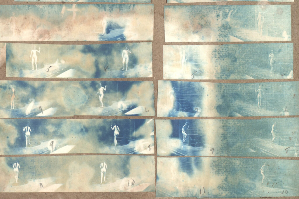 A close-up of several cyanotypes of a naked woman turning and ascending stairs, waving her hand, in a study of motion.